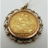 A 1904 gold full sovereign in mount,