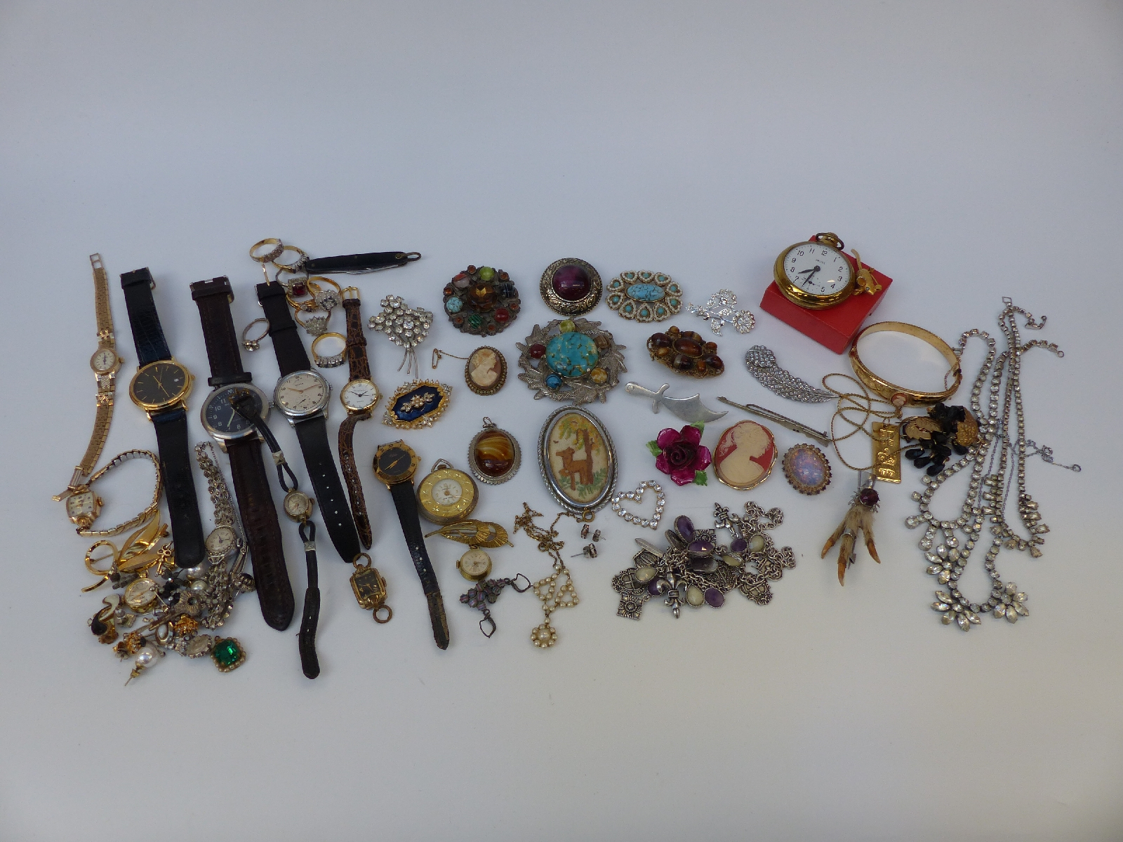 A collection of costume jewellery including rings, brooches including Miracle and Mizpah,