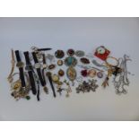 A collection of costume jewellery including rings, brooches including Miracle and Mizpah,