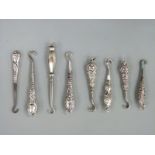 Eight various small hallmarked silver handled button hooks