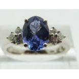 An 18ct white gold ring set with a tanzanite and diamonds, size N/O, 4.