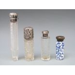 Four hallmarked silver mounted glass and porcelain scent bottles, three Victorian,