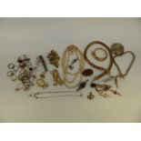 A collection of costume jewellery to include snake necklaces, two RAF brooches, rings,