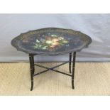 A 19thC papier maché table in the Betteridge style on aesthetic style faux bamboo base,