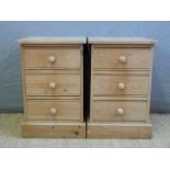 A pair of pine three drawer bedside cabinets,