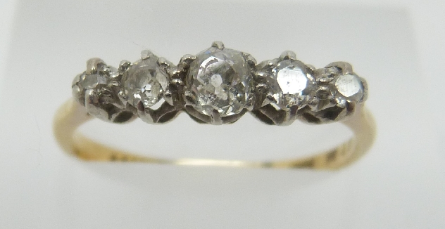 An 18ct gold ring set with five old cut diamonds in a platinum setting, - Image 3 of 3