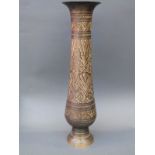 An engraved Persian tall metal vase,