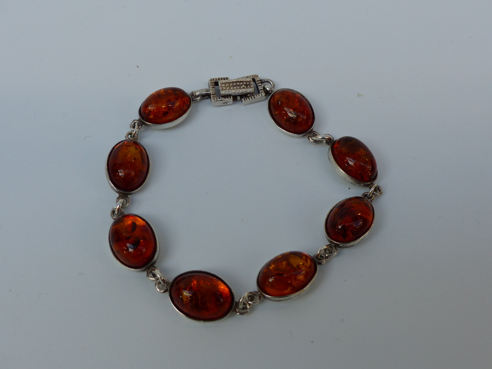 A collection of silver jewellery set with pressed amber, - Image 5 of 9
