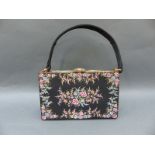 A 1950s 'Waldybag' evening bag with floral decoration, containing a matching Stratton compact,