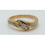 An 18ct gold ring set with diamonds totalling approximately 0.22ct in a twist setting, 2.