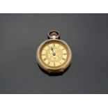 A 9ct gold ladies keyless winding open faced pocket watch with engraved self coloured face,