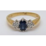An 18ct gold ring set with an oval cut sapphire of approximately 0.