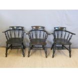 Three elm seated Windsor captain's chairs