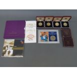 A collection of cased and packed Royal Mint and other coins to include £5,