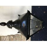 A cast iron Victorian/Victorian style street lamp base with associated lamp (detached),