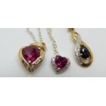 Two 9ct gold pendants set with synthetic rubies and a 9ct gold pendant set with a sapphire and