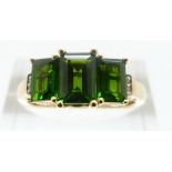 An 18ct gold ring set with diopside and diamonds, size O/P,