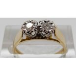 An 18ct gold ring set with two brilliant cut diamonds, size N, 3.