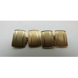 A pair of 9ct gold cufflinks with engine turned design,