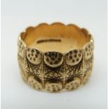 A 9ct gold ring with unusual textured design, 8.