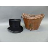 A Lock & Co silk top hat in fitted leather case