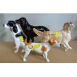 Four boxed John Beswick dog figures including chocolate Cocker Spaniel from the Connoisseur