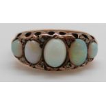 A 9ct gold ring set with five graduated opal cabochons and diamonds, Birmingham 1916, size P,