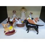 A collection of Beswick and Royal Doulton dog figures including Chihuahua,