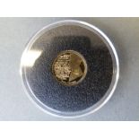 A 2014 1914/1918 commemorative miniature gold crown with Lawrence Binyon 'At the Going Down of the