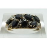 A 9ct gold ring set with sapphires and diamonds, size P, 2.