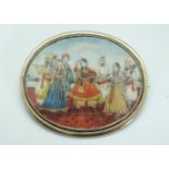 A miniature portrait brooch hand painted with an Indian dancing scene,