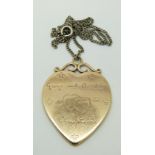A Courtauld gold heart pendant engraved George & Claudia Courtauld 2 Juin Paris 1936.