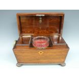 A 19thC rosewood tea caddy having cut glass mixing bowl flanked by two lidded compartments,