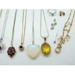 A collection of silver jewellery to include tiger's eye earrings and pendant, two silver rings,