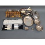 A collection of plated ware including a cased Garrard carving set, pair of pierced bon bon dishes,