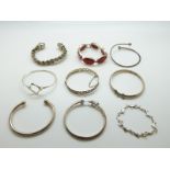 Seven silver bangles and two silver bracelets