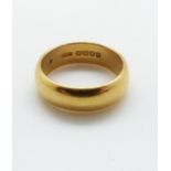 A 22ct gold wedding band, 10.