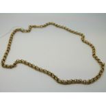 A yellow metal fob chain made up of circular links,