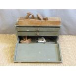 A vintage tool chest and contents including brass inlaid square, planes etc,