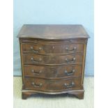 A serpentine fronted chest of four graduated drawers,