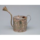 A white metal novelty watering can with embossed decoration, stamped to base with 930 silver marks,