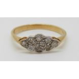 An 18ct gold ring set with diamonds in a platinum setting, 2.