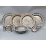 Four 18th / 19thC pewter chargers one with touch marks, diameter 38cm,