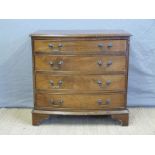 A small bow fronted graduated chest of four drawers,