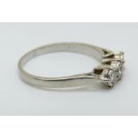 An 18ct white gold ring set with three diamonds totalling approximately 0.