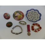 A collection of enamel items including Persian dish, English plaques, Russian enamel brooch,