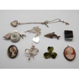 A silver brooch set with a shell in the form of a snail, a banded agate miniature book,