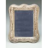 A modern hallmarked silver mounted photograph frame to suit 7 x 5 inch photograph,