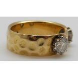 An 18ct gold ring set with two diamonds each approximately 0.6ct, size O, 8.