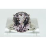A 14ct white gold ring set with a pink topaz, size O/P, 4.